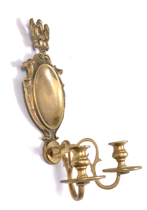 Cast brass wall sconce, in the Baroque style, eagle surmount, twin branches, 28cms.