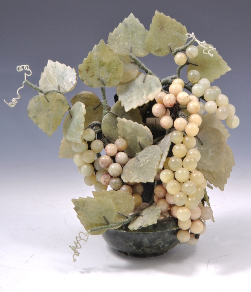 Jadeite and hardstone arrangement of fruiting vines, set with a spinach coloured bowl, 26cms.