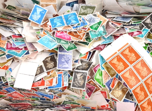 Stamps:  A collection of stamps and postcards, including a box of machins and year books.