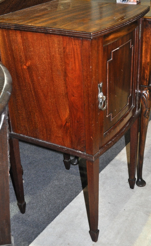 Edwardian mahogany bow front bedside cabinet, panelled door, square tapering legs, width 42 cms.