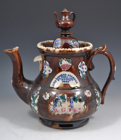 Bargeware teapot, "MRS THOMAS ALLCOCK, FLEEZELAND, NOTTS 1896" and a teapot finial, applied