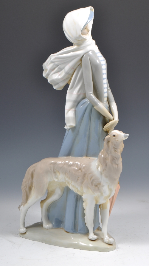 Large Lladro figure of a lady with a lurcher dog, 42cms.