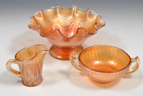 Amber-tinted Carnival Glass bowl, moulded decoration, diameter 23cms, two other amber-tinted