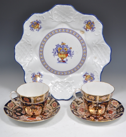 Pair of Derby style "Imari" pattern cups and saucers and a pottery shallow dish, diameter 32cms.