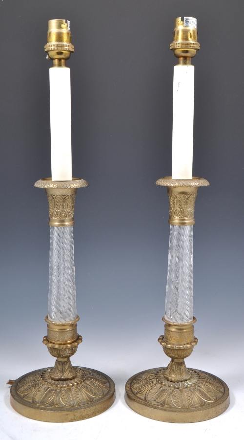 Pair of Empire style brass and glass sectioned candlestick lamp bases, 44cms and two other brass