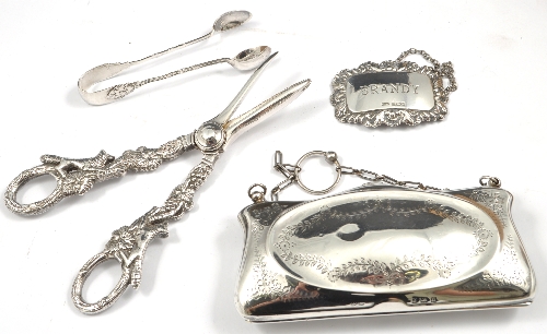 Silver evening purse, Birmingham 1912, engraved decoration, 13cms, a silver brandy label, a pair