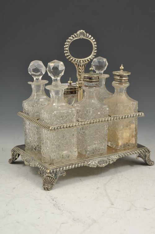 Electroplated cruet, of rectangular form with six cut-glass condiments, 25cms.