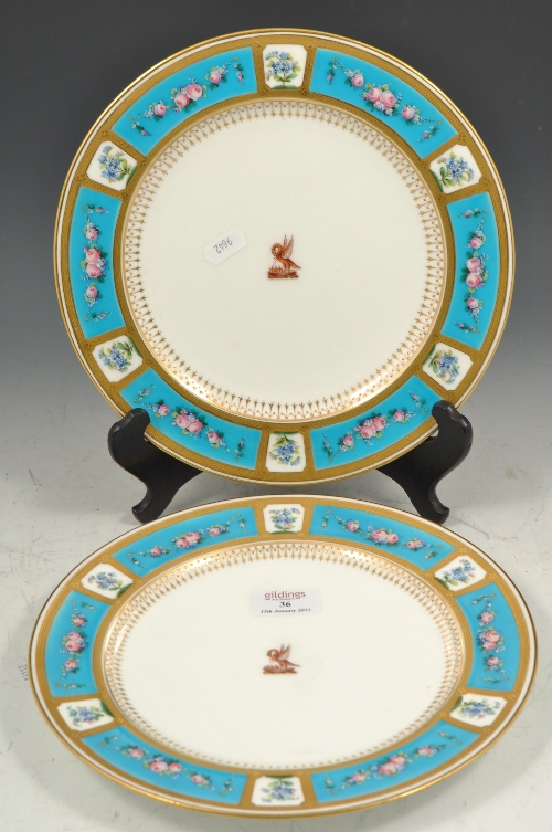 Pair of Minton Sevres style armorial dinner plates, the borders with rose festoons within blue