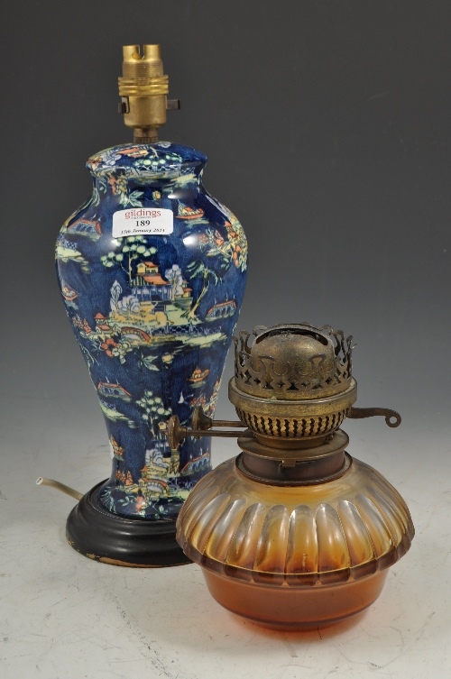 Victorian oil lamp, cast base, moulded and tinted glass reservoir with a chimney, 62cms, another oil