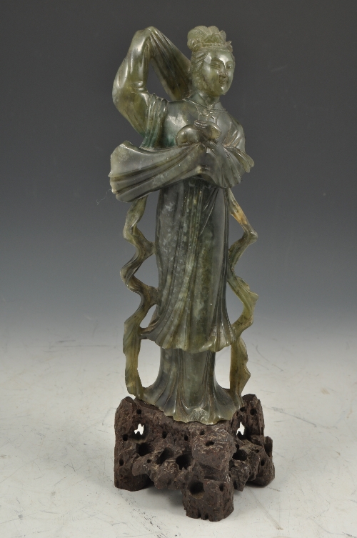 Chinese jade coloured soapstone figure,  of a woman standing on a brown coloured plinth, 33cms