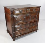 A late 17th century walnut chest, of four long drawers with geometric moulded fronts, W.3ft 2in. H.