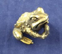 A 1970`s silver gilt free standing model of a pensive toad by Start Devlin, London, 1973, 1.25in.