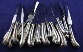 A set of six George VI silver pistol handled table knives and six matching dessert knives, George