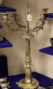 A large ornate electroplated four branch five light candelabrum, with acanthus leaf scroll arms,