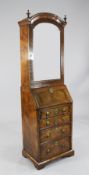 An early 18th century style banded walnut bureau bookcase, of small proportions, with bevelled