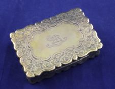 A Victorian silver gilt table snuff box, of shaped rectangular form, with engraved armorial and