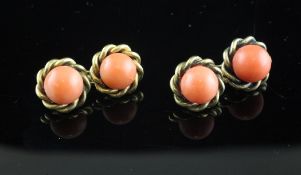 A pair of gold and coral bead set cufflinks, with rope twist border.