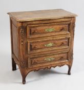 A mid 18th century Low Countries miniature oak commode, with serpentine top and three long
