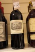 Three bottles including two Chateau Lafite 1997, Premier Cru Classe, Pauillac, into neck; labels and