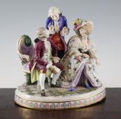 A German porcelain group, late 19th century, modelled as a seated lady and gentleman in 18th century