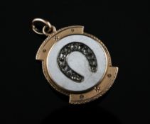 A gold, white enamel and diamond set pendant locket with horseshoe motif, 1in.