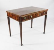 A Regency mahogany writing table, with draw leaf flaps and frieze drawer, on squared tapered legs