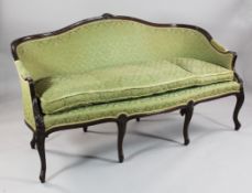 An Edwardian Georgian style mahogany settee, with fluted showwood frame, scallop carved knees and