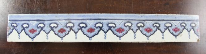 A Chinese blue and white frieze section, 18th century, painted with repeating pendant design of ruyi