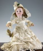 A late Victorian bisque head doll, with sleeping eyes and open mouth, stamped marks to back of