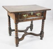 A late 17th century oak side table, the overhanging top fitted beneath a single drawer on bobbin