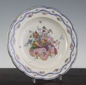 An Arras soft paste porcelain plate, late 18th century, finely painted with a basket of fruit and