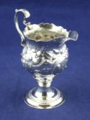 A George III silver inverted pear shaped pedestal cream jug, by Robert Hennell I, with later