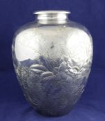 An early 20th century Japanese Meiji period silver baluster vase, engraved with peonies and three