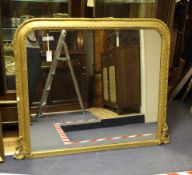 A Victorian gilt gesso overmantel mirror, with arched plate, 4ft H.3ft 3in.