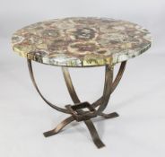 A large circular table top made from fossilised wood slices, Triassic period (200-250 million