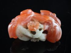 A Chinese chalcedony carving of tree buds, 18th/19th century, the buds carved from the coral-red