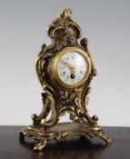 A French ormolu mantel timepiece, with Louis XVI style floral scroll case and enamelled Roman