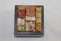 A Chinese soapstone boxed seal set, 19th century, the square cover incised with a view of ship at