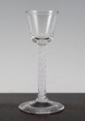 An opaque twist semi-cordial glass, c.1760, the bucket bowl above a double series stem, on a conical