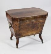 A George III mahogany sarcophagus cellaret, with boxwood stringing, octagonal top and short sabre