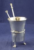 An Edwardian silver vase, with flared rim, with banded girdle, on tripod supports with paw feet,
