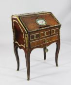 A late 19th century French ormolu mounted kingwood bureau de dame, inset with Sevres style porcelain