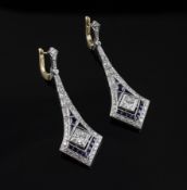 A pair of white and yellow gold sapphire and diamond drop earrings, of arrow head design, with