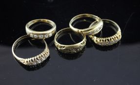 Five early 20th century 18ct gold and diamond set rings, five stone half hoop(4) and three stone