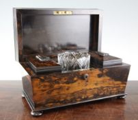 A Victorian coromandel wood sarcophagus tea caddy, with two canister and cut glass bowls, 14.5in.