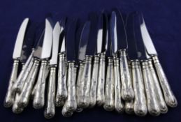 A set of twelve 1970`s silver handled King`s pattern table knives and twelve matching dessert