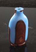 A Chinese realgar and blue glass snuff bottle, 19th / 20th century, 6.5cm