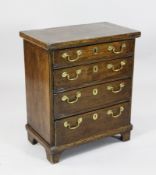 A small 18th century style oak chest, of four long drawers, on bracket feet, 1ft 11in. H.2ft 3in.