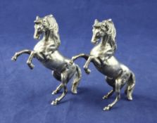 A pair of 20th century middle eastern silver free standing miniature models of rearing horses, 3.