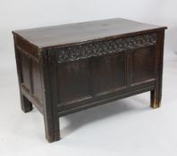 An early 18th century oak coffer, with triple panel front, on stile feet, 3ft 6in. H.2ft